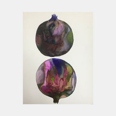 The artwork 'c1' by Arielle Stein features two circular pomegranate forms in fluid watercolor and acrylic ink. The top sphere shows deep purples and greens melding together, while the bottom displays vibrant pink, blue, and olive tones flowing in abstract patterns. Both forms are rendered on cream paper with delicate crown-like stems.