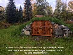 Our Classic Slide Bolt, clavos and stainless steel hinges on an unusual storage building - Wild West Hardware