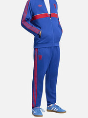 ADIDAS ORIGINALS Manchester United FC OG2 - Royal Blue – yandan görünüm, kırmızı üç şeritli fermuarlı eşofman üstü