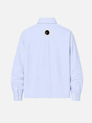 shopi go Meguro Regular Shirt – açık mavi, arka görünüm, küçük siyah daire logolu etiket