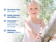 Mustela USA | Smiling young girl outdoors in a sunny garden. Key product benefits: no need to rinse with water, gently cleanses and softens skin, convenient for in-between bath time and on-the-go, effectively removes makeup.