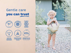 Mustela USA | Toddler walking barefoot outdoors carrying a straw basket. Text: Gentle care you can trust. Certified NSF/ANSI 305, EWG Verified, and B Corporation. Safe for newborns from birth, dermatologist and pediatrician tested, 97% ingredients of natural origin