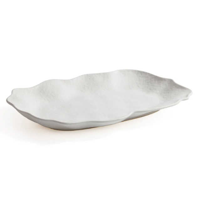 The Zodax Alto Rectangle Ceramic Platter features a white, textured surface and gently wavy, irregular edges—ideal as a centerpiece. Shown on a plain white background.