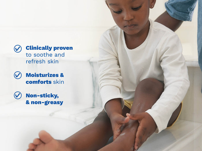 Mustela USA | Child sitting on a bathroom counter applying gel to their leg.