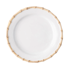 The Juliska Bamboo Dinnerware is a white ceramic plate with a raised rim styled like light brown bamboo stalks, shown from above on a white background.