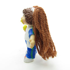 Cabbage Patch Kids miniature figurine with brown yarn hair and I Love You t-shirt