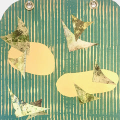 The artwork 'Flight' by Sunny Chapman features abstract birds in metallic silver and white soaring across a teal background with vertical stripes. Yellow oval shapes float between the birds, creating a sense of movement. The mixed media piece combines monotype prints, metallic paper, and acrylic on premium cover stock, finished with decorative grommets.