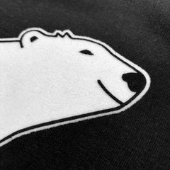 Closeup of polar bear's face showing soft texture of flocking.