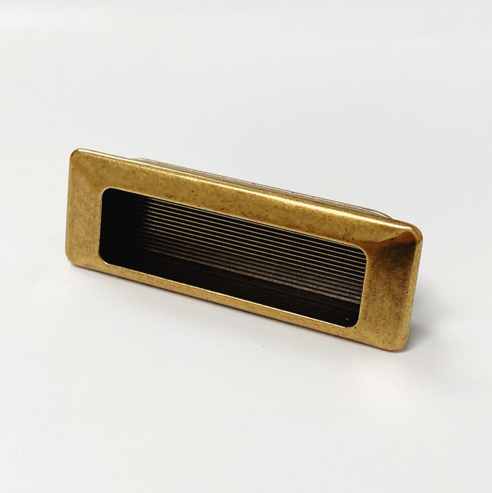 Forme Recessed Cabinet and Closet Pulls in Antique Brass Finish — form, finish and mounting detail