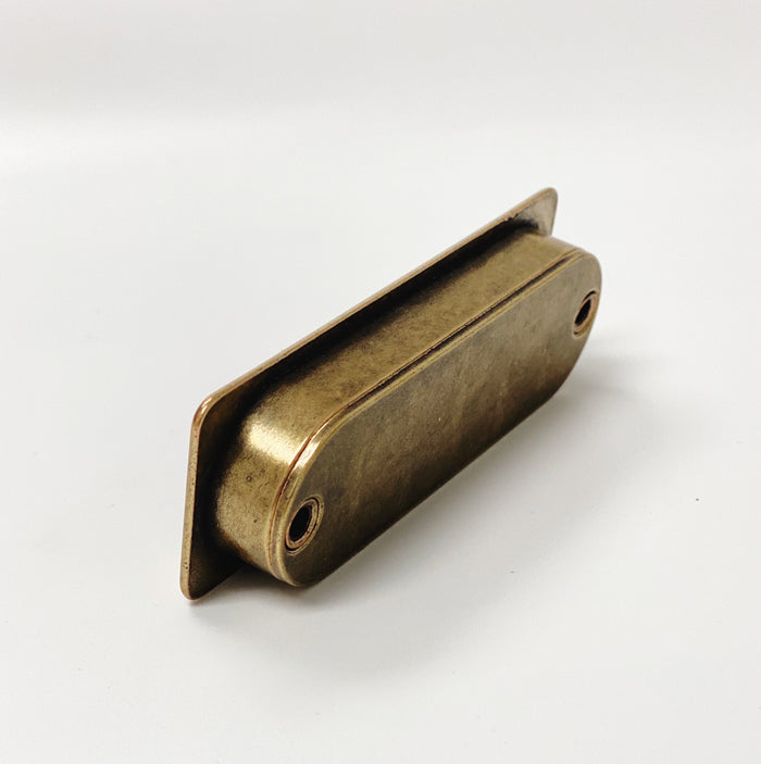 Forme Recessed Cabinet and Closet Pulls in Antique Brass Finish — form, finish and mounting detail