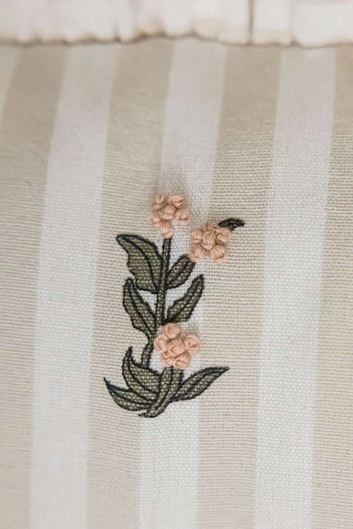 Frances Striped Cotton Pillow Cover with Ruffle — close view of a floral motif on striped cotton; Galley & Fen