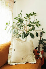 Frances Striped Cotton Pillow Cover with Ruffle — Frances cover displayed on a chair beside separate seasonal decorations; Galley & Fen