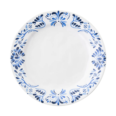 The Juliska Iberian Dinnerware features a round white dinner plate with a cobalt blue floral rim pattern inspired by Iberian Journey tiles; the center is plain and unadorned.