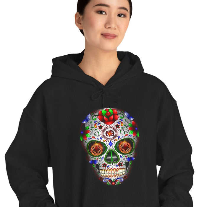 Person wearing a black hoodie with a colorful skull design on a white background