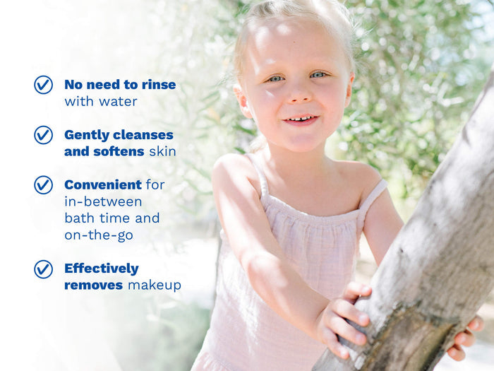 Mustela USA | Smiling young girl outdoors in a sunny garden. Key product benefits: no need to rinse with water, gently cleanses and softens skin, convenient for in-between bath time and on-the-go, effectively removes makeup.