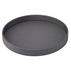 The Bodrum Skate Round Tray - Charcoal is a round, shallow serving tray with a textured, phthalate-free surface and raised edges, shown here in dark gray on a white background.