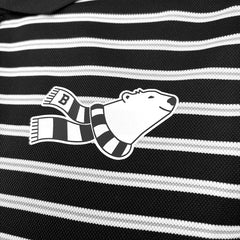 Closeup shot of chest imprint featuring a smiling cartoon polar bear bust in a black and white striped scarf.
